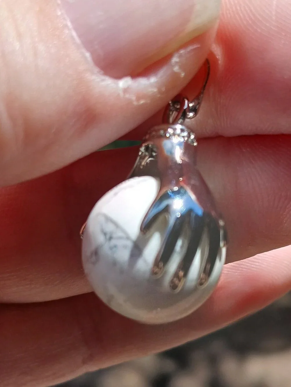 New 18K Hands Holding Howlite Sphere Pendant.